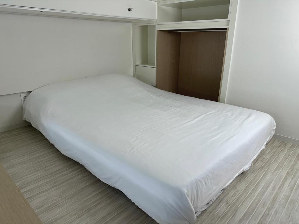 Postel nebo postele na pokoji v ubytování Grape Residence Hotel