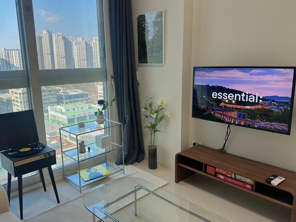 TV a/nebo společenská místnost v ubytování Grape Residence Hotel