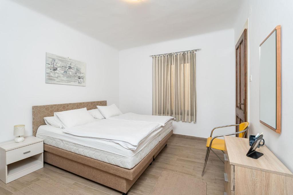 Postel nebo postele na pokoji v ubytování Apartment Family Tokic