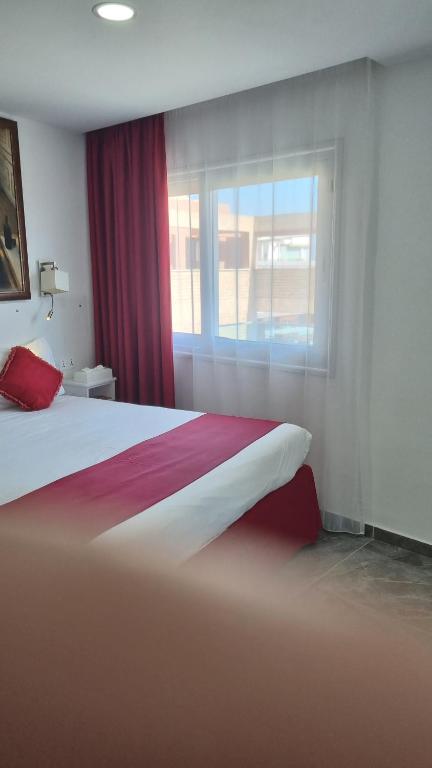 Postel nebo postele na pokoji v ubytování Art & Wine Boutique Hotel