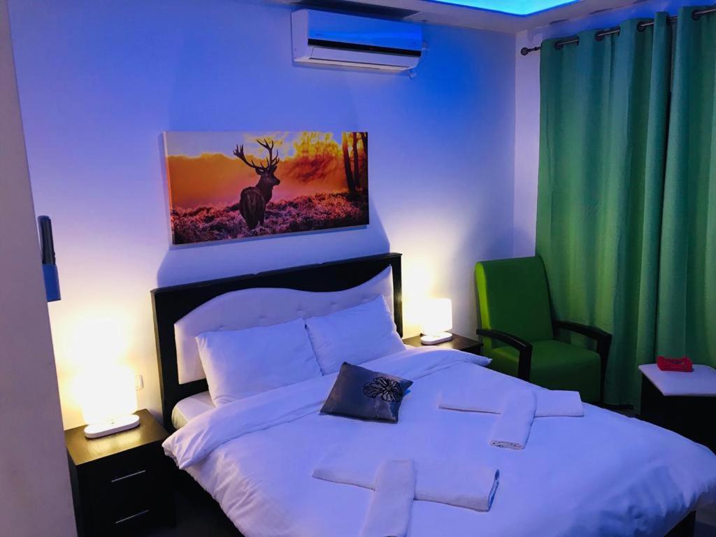 Postel nebo postele na pokoji v ubytování Assaraya Palace Hotel