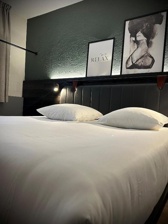Postel nebo postele na pokoji v ubytování Tulip Inn Beaune