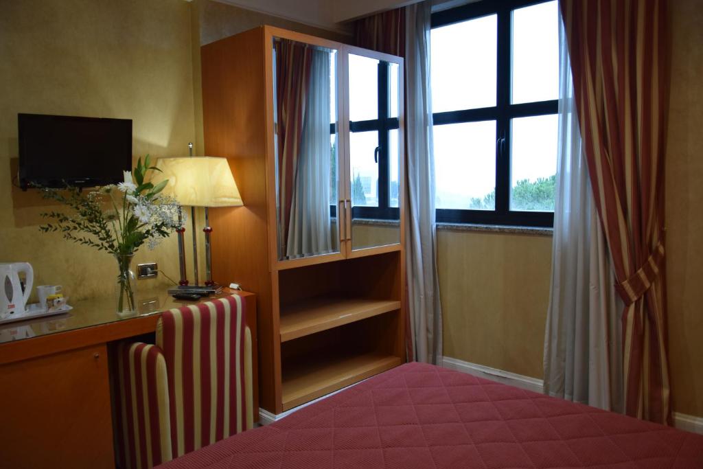 Postel nebo postele na pokoji v ubytování Hotel Perusia
