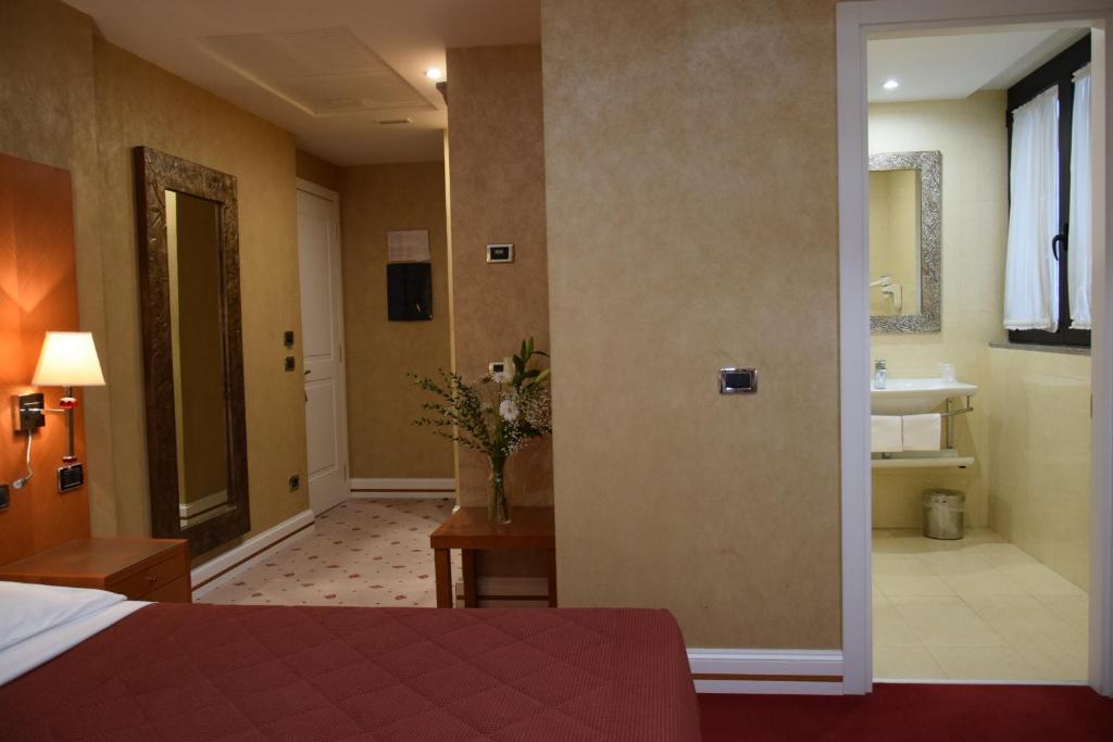Postel nebo postele na pokoji v ubytování Hotel Perusia