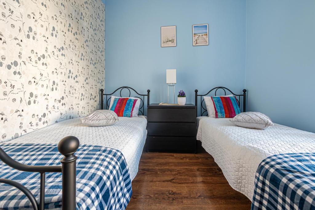Posteľ alebo postele v izbe v ubytovaní Długa Comfort Apartments