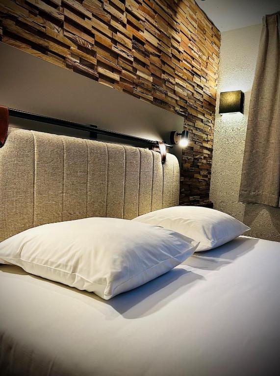 Postel nebo postele na pokoji v ubytování Tulip Inn Beaune