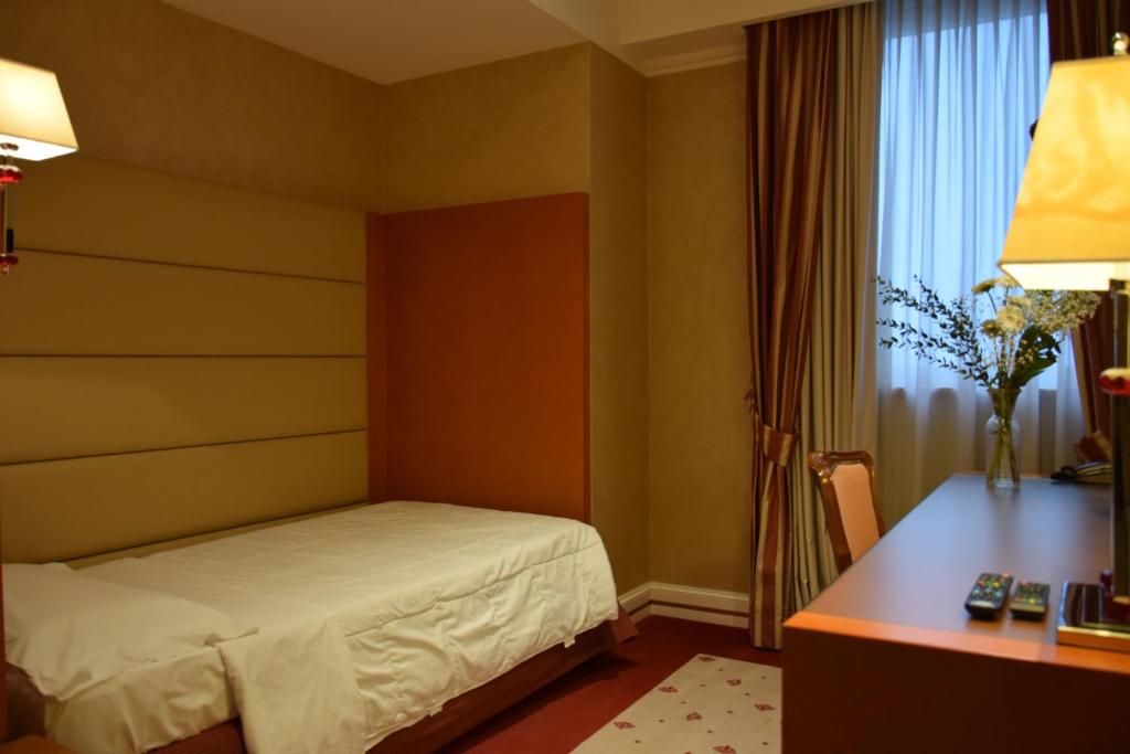 Postel nebo postele na pokoji v ubytování Hotel Perusia