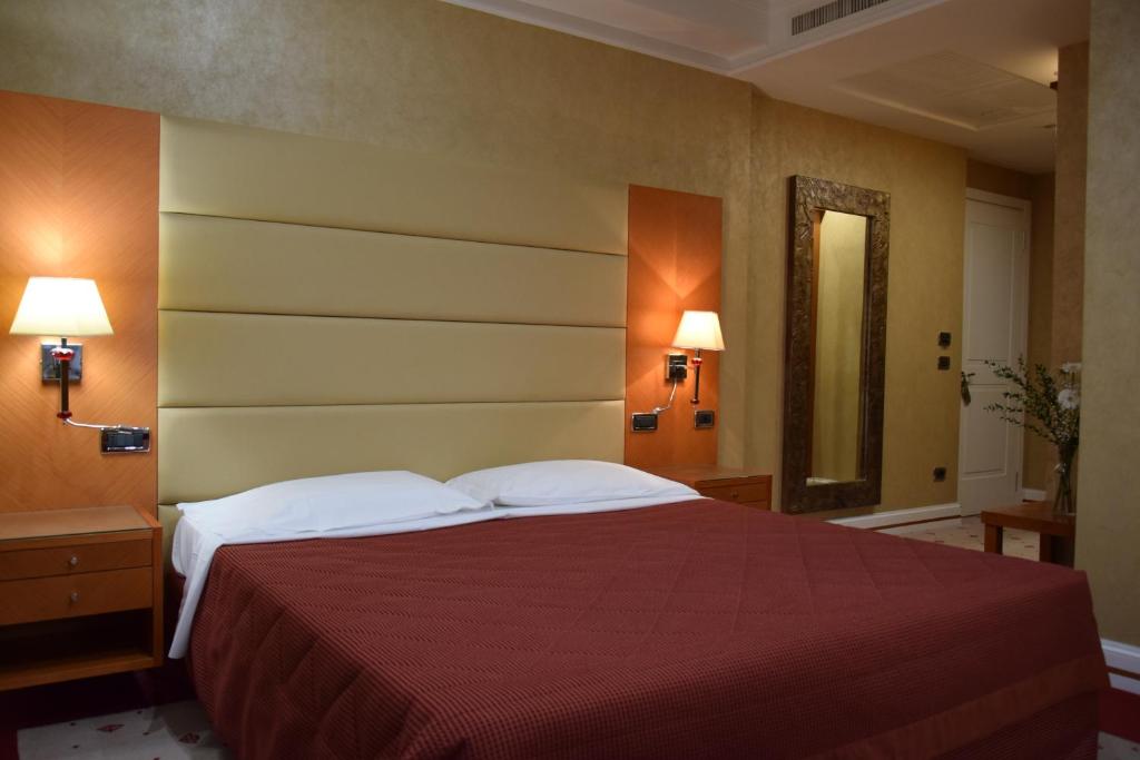 Postel nebo postele na pokoji v ubytování Hotel Perusia