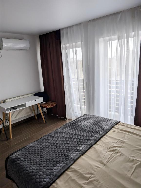 Postel nebo postele na pokoji v ubytování Ізумруд