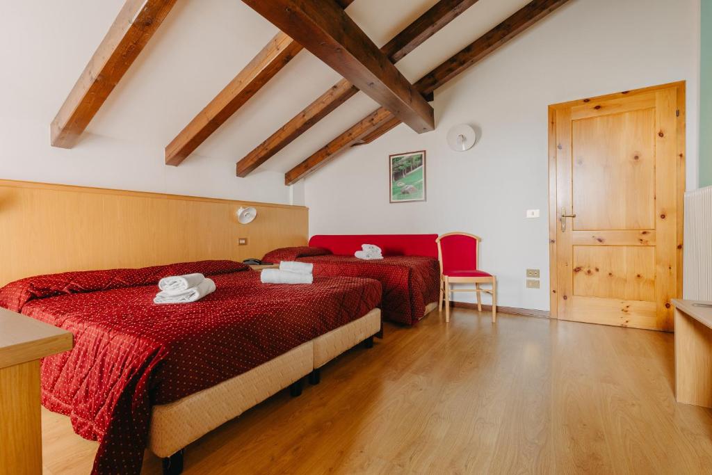 Łóżko lub łóżka w pokoju w obiekcie Hotel Spera