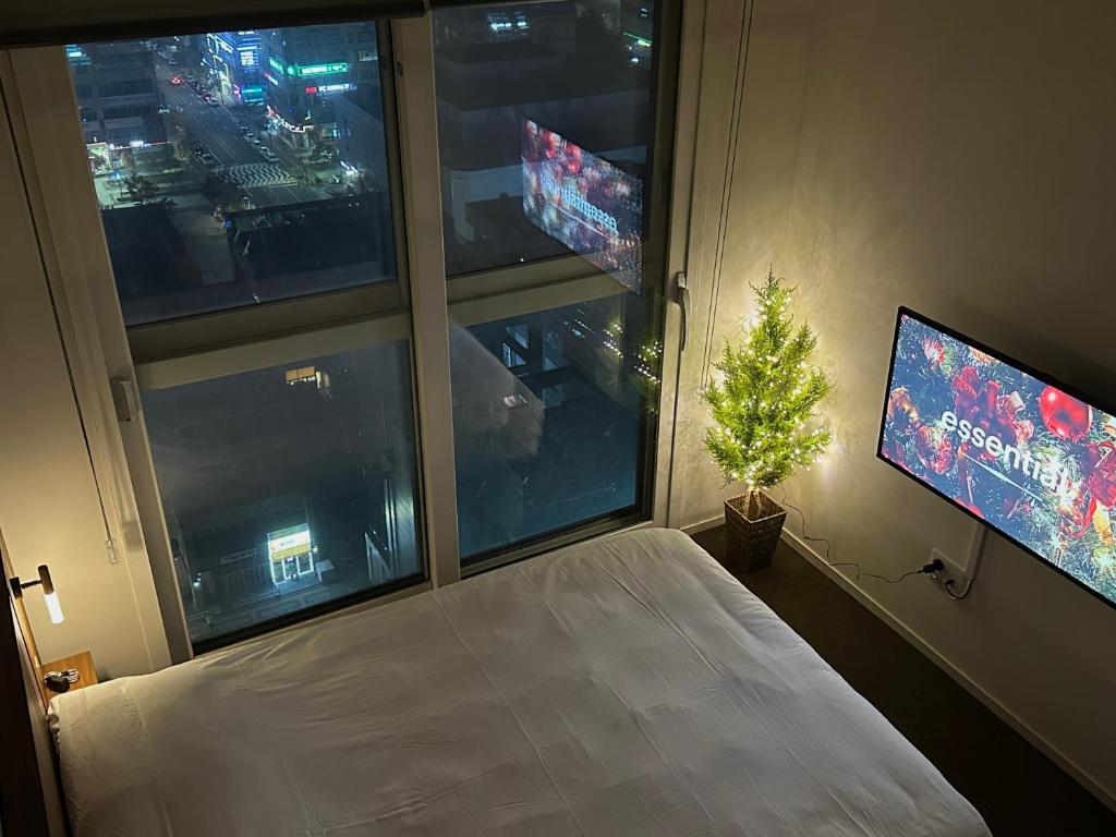 Postel nebo postele na pokoji v ubytování Grape Residence Hotel
