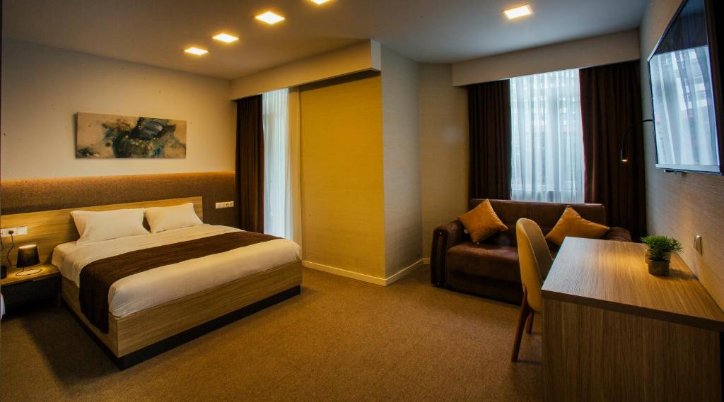 Postel nebo postele na pokoji v ubytování West Hotel Ataman