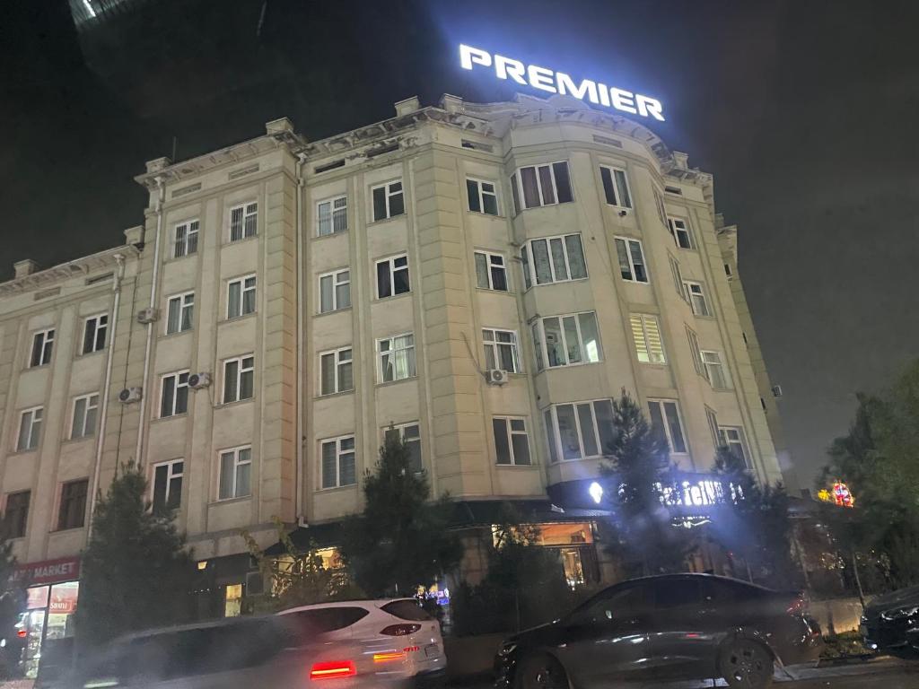 a large building with a sign on top of it at Cozy apartment 2 in Samarkand