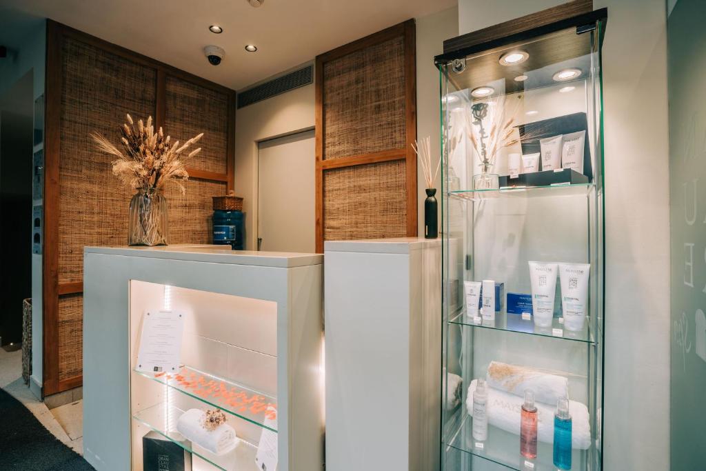 a refrigerator with its door open in a room at Gran Claustre Boutique Hotel in Altafulla