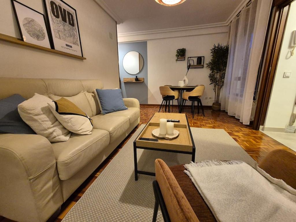 a living room with a couch and a table at R2R - El Rincon del Riego - 655A in Oviedo