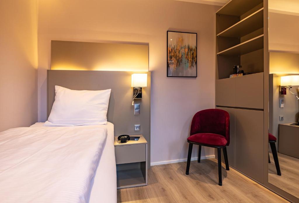 Postel nebo postele na pokoji v ubytování MEA HOTEL TRIER