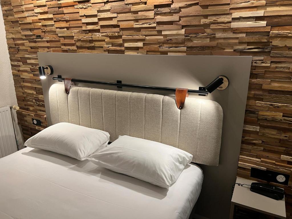 Postel nebo postele na pokoji v ubytování Tulip Inn Beaune