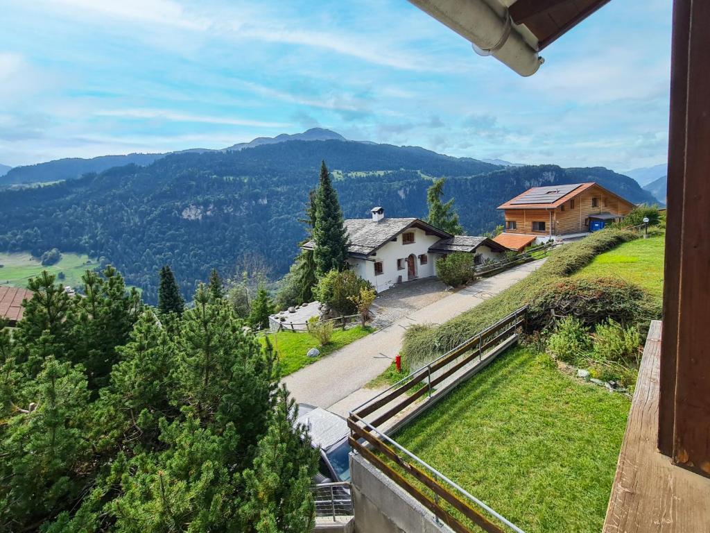 a view from the balcony of a house in a mountain at Apartment Crap Grisch by Interhome in Ruschein