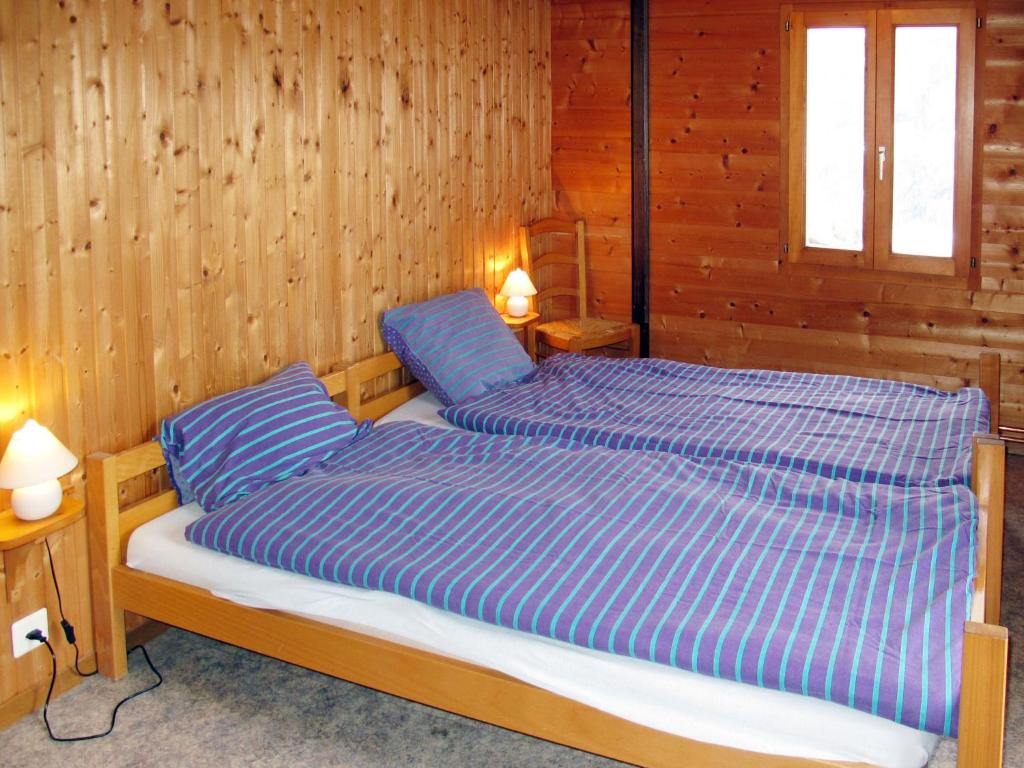 Postel nebo postele na pokoji v ubytování Apartment Chalet Anthamatten-1 by Interhome