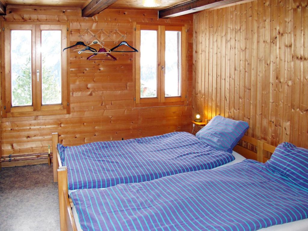 Postel nebo postele na pokoji v ubytování Apartment Chalet Anthamatten-1 by Interhome