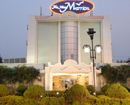a building with a sign on top of it at The New Marrion in Bhubaneshwar
