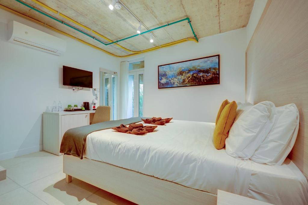 TV a/nebo společenská místnost v ubytování Kirxa Rooms and Suites