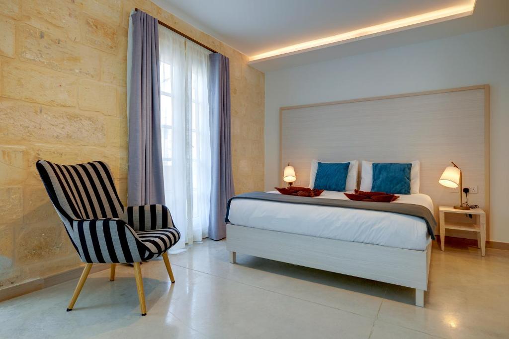 Postel nebo postele na pokoji v ubytování Kirxa Rooms and Suites