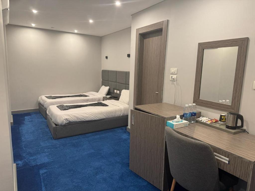 Postel nebo postele na pokoji v ubytování nuba nile hotel