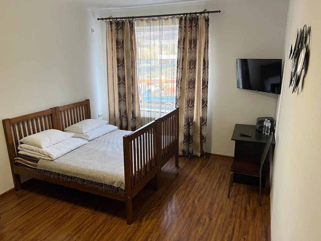 Postel nebo postele na pokoji v ubytování PETROVICH hotel