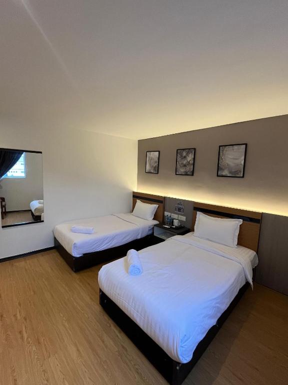 Postel nebo postele na pokoji v ubytování Havona Hotel - Bandar Putra Kulai - Self Check-In