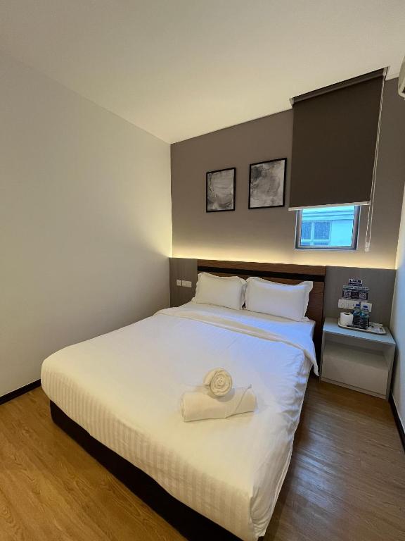 Postel nebo postele na pokoji v ubytování Havona Hotel - Bandar Putra Kulai - Self Check-In