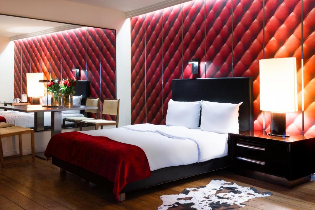 Postel nebo postele na pokoji v ubytování Hotel Adele am Alex