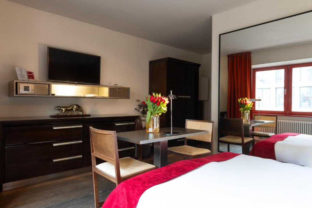 Postel nebo postele na pokoji v ubytování Hotel Adele am Alex