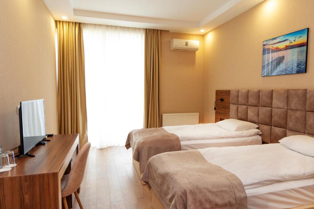 Postel nebo postele na pokoji v ubytování Aniko Hotel
