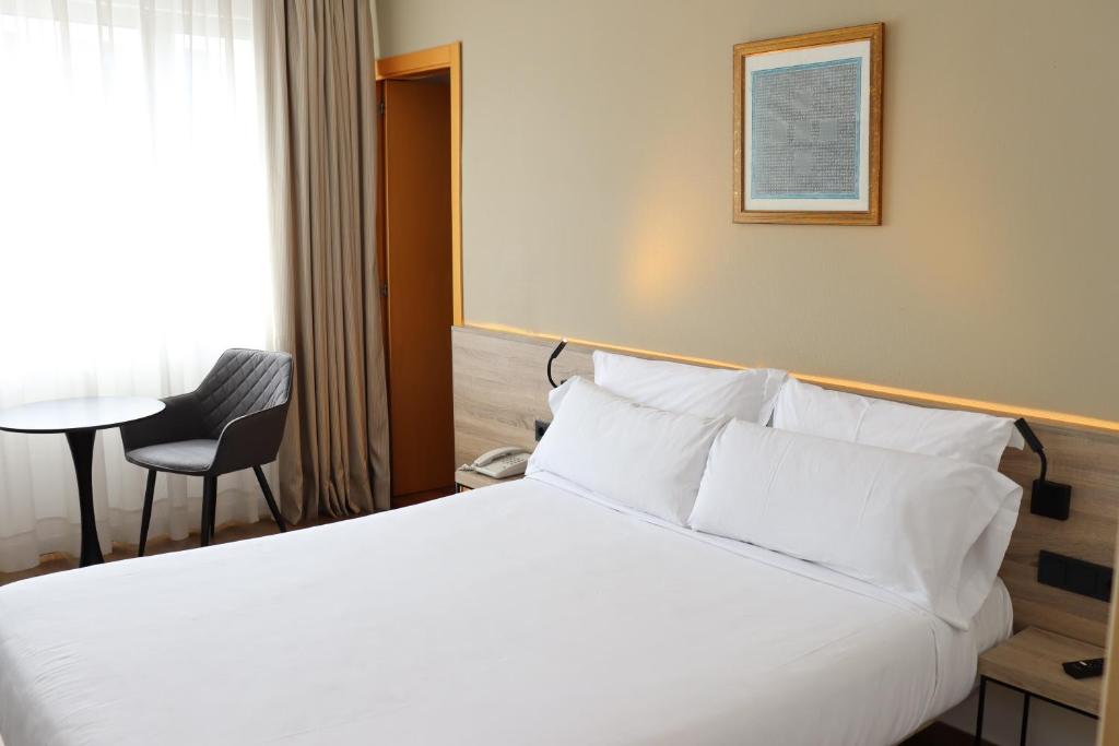 Postel nebo postele na pokoji v ubytování Eurohotel Diagonal Port