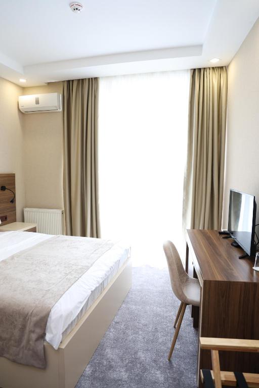 Postel nebo postele na pokoji v ubytování Aniko Hotel