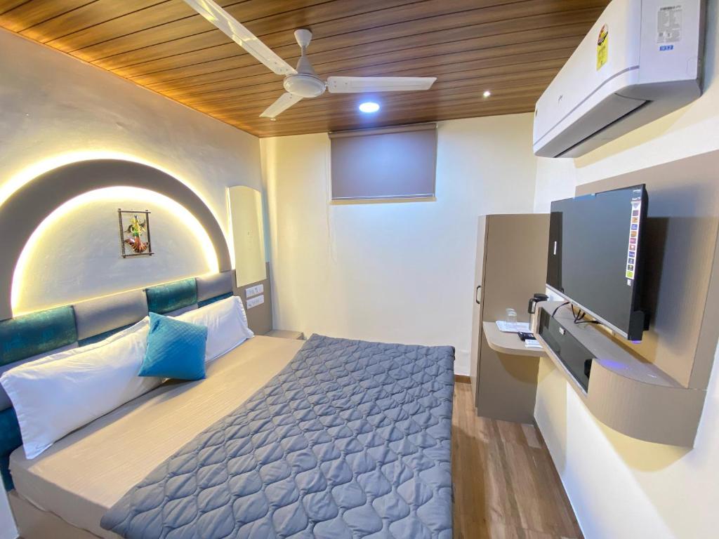 Postel nebo postele na pokoji v ubytování Hotel RV Residency