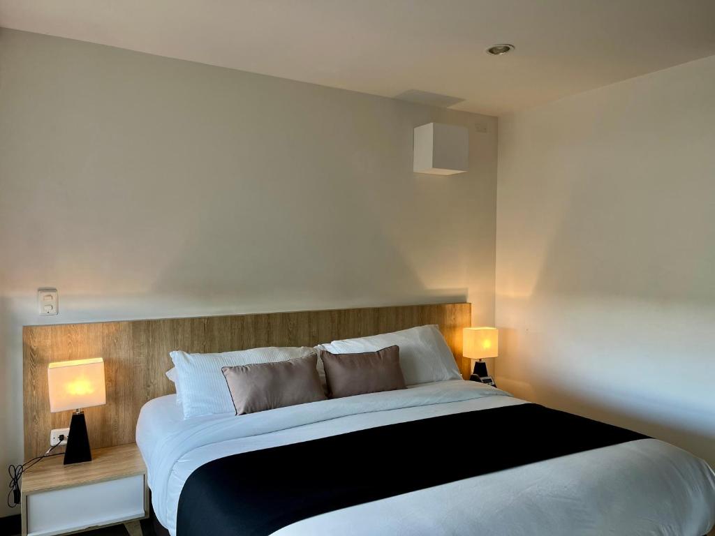 Postel nebo postele na pokoji v ubytování Suites - Hotel Rioverde