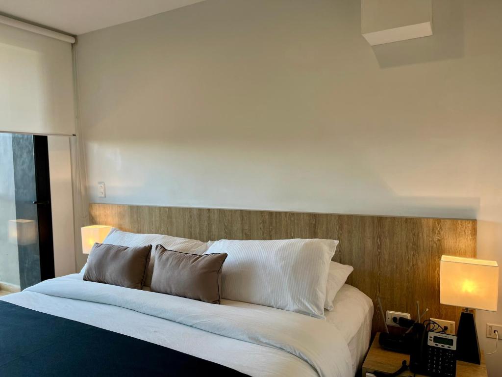 Postel nebo postele na pokoji v ubytování Suites - Hotel Rioverde