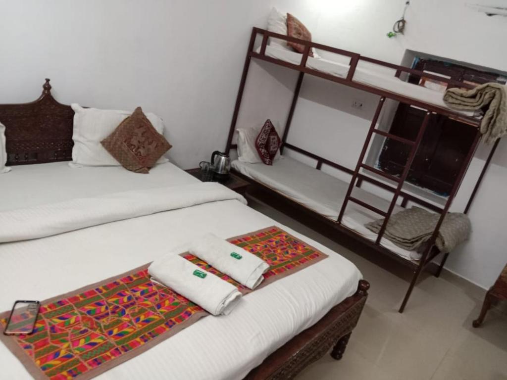 Postel nebo postele na pokoji v ubytování Tofu Guesthouse