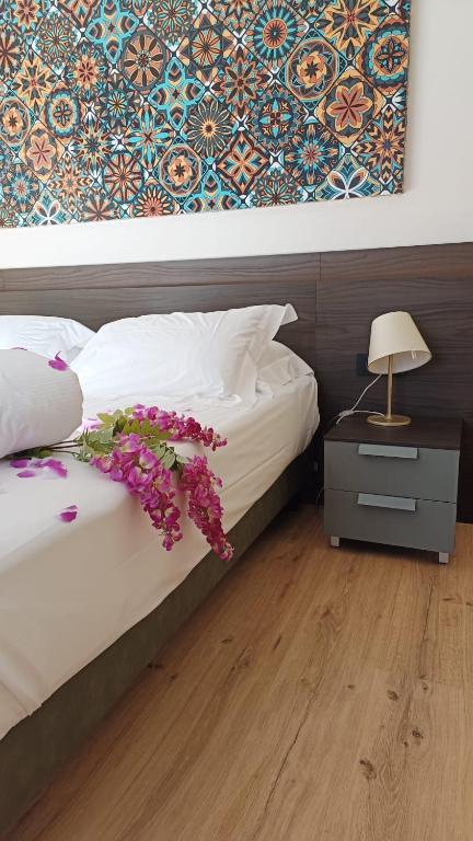 Postel nebo postele na pokoji v ubytování Hotel Villa Cuserina