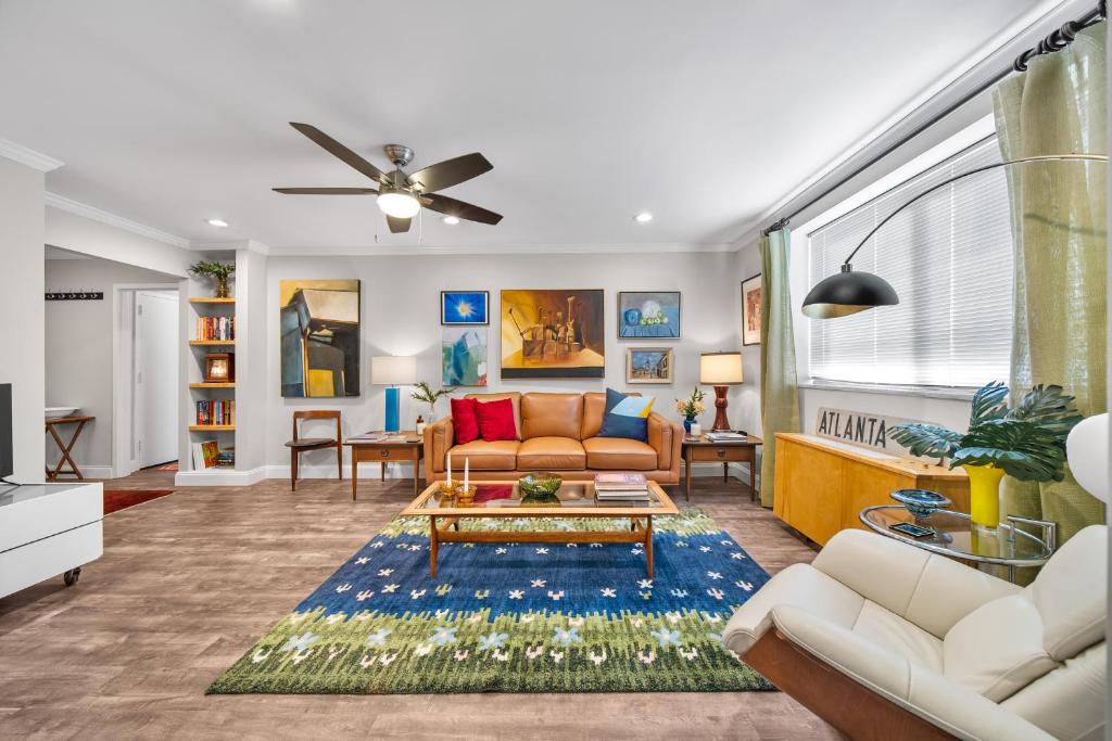 a living room with a couch and a table at Urban-eclectic Downtown Condo W Parking, Sleeps 4 in Atlanta