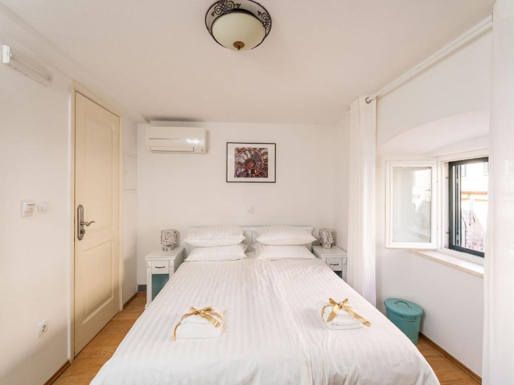 Posteľ alebo postele v izbe v ubytovaní Lumin Guest House