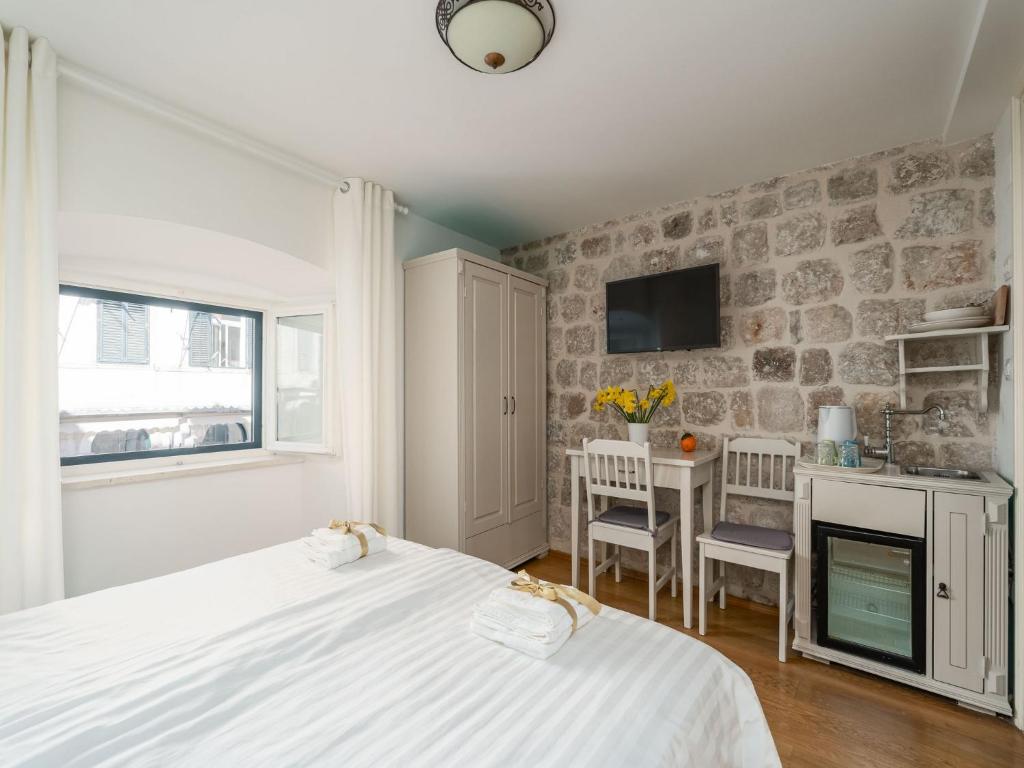 Posteľ alebo postele v izbe v ubytovaní Lumin Guest House