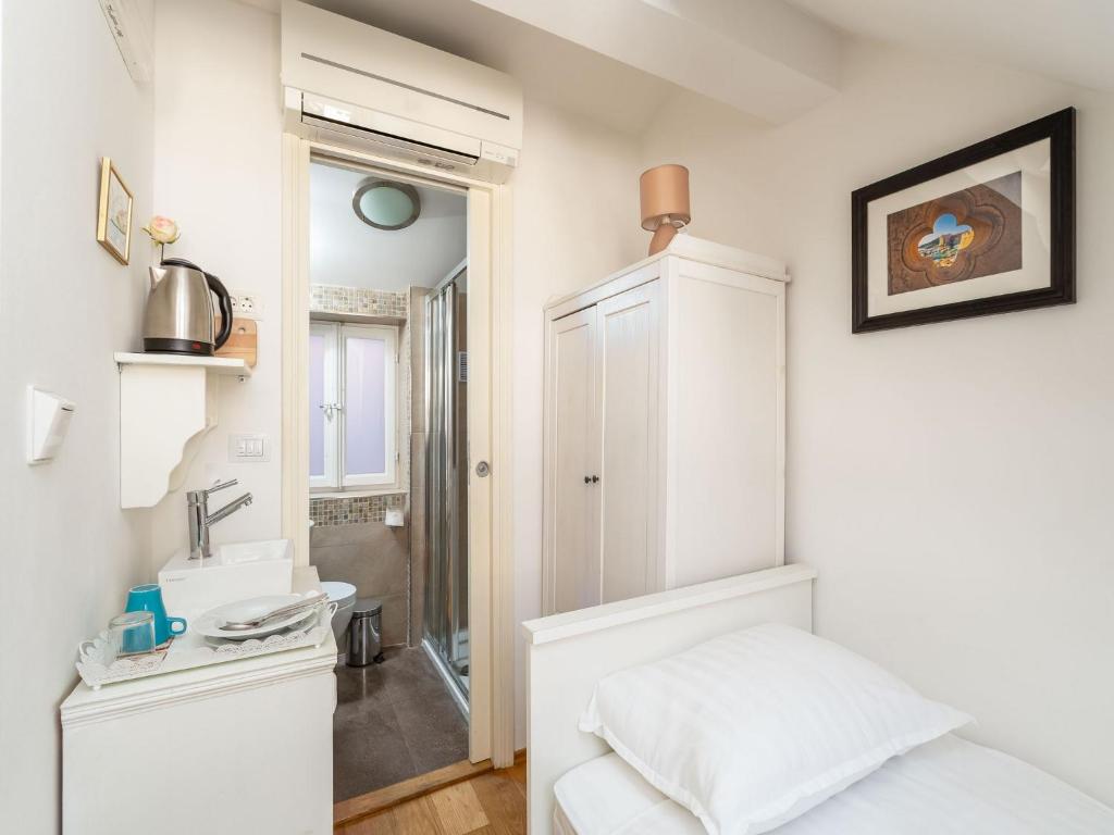 Posteľ alebo postele v izbe v ubytovaní Lumin Guest House