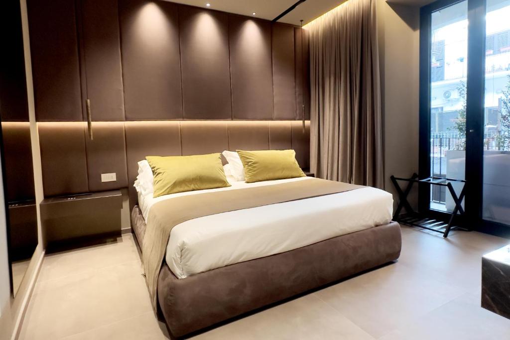 Postel nebo postele na pokoji v ubytování Donna Filomena Luxury Suites