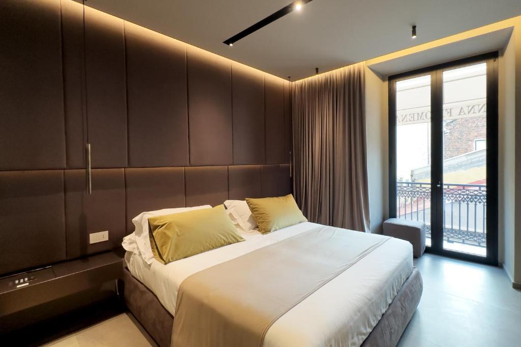 Postel nebo postele na pokoji v ubytování Donna Filomena Luxury Suites