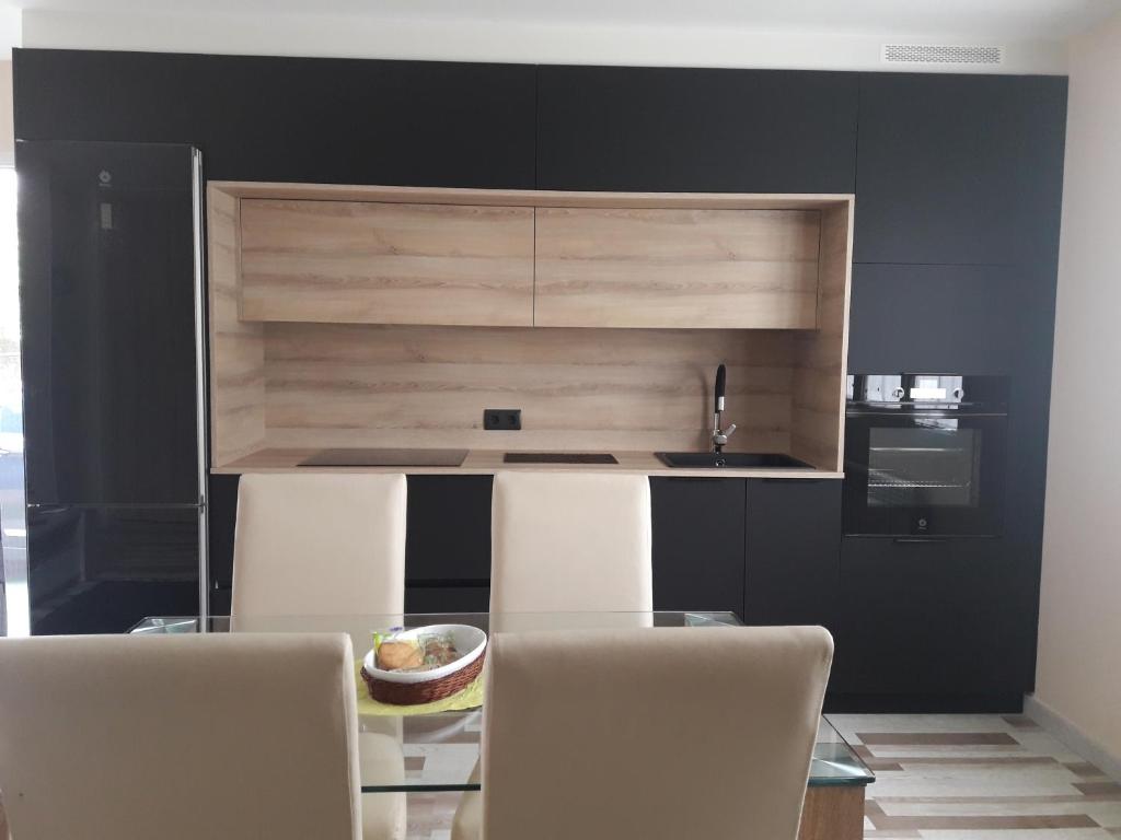 Kuchyň nebo kuchyňský kout v ubytování Besbello Suites Apartamento