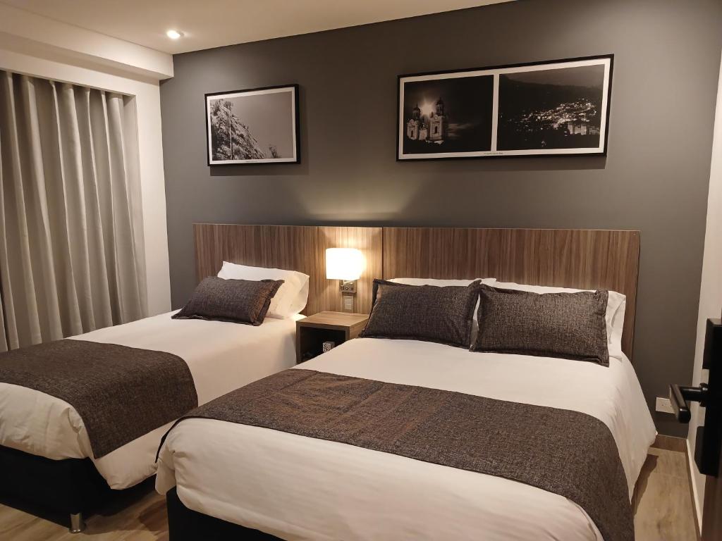 Postel nebo postele na pokoji v ubytování Hotel Santino