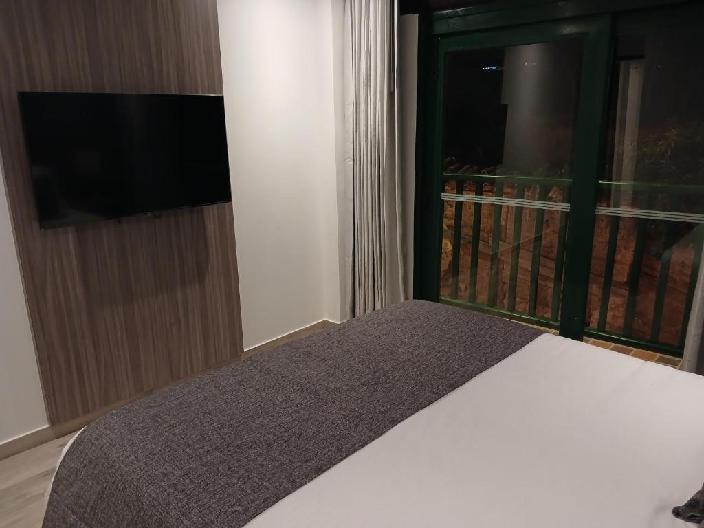 TV a/nebo společenská místnost v ubytování Hotel Santino